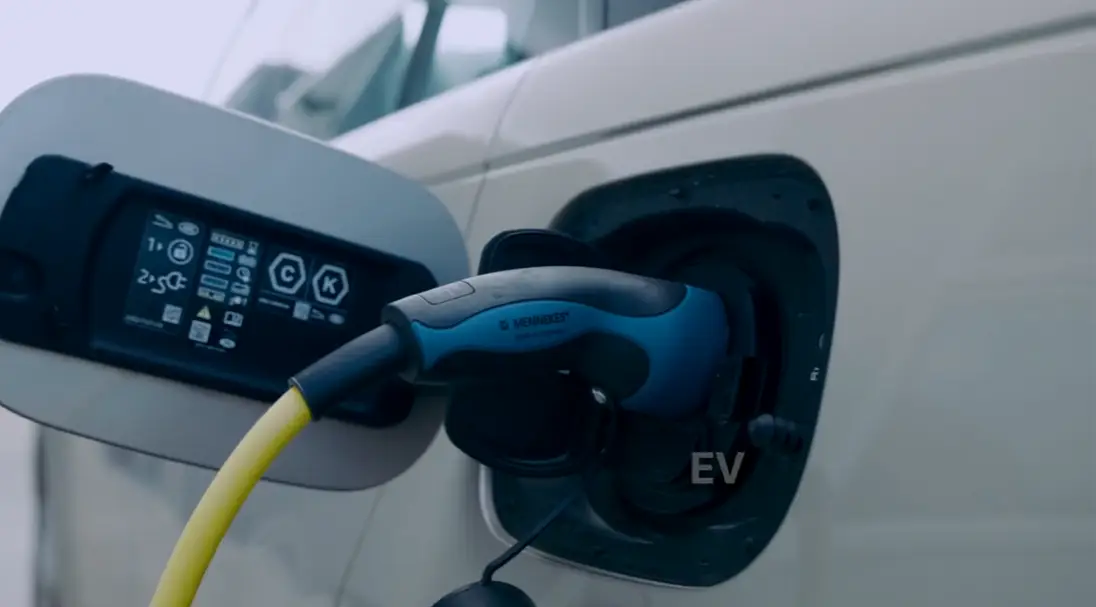 Electric vehicle charging at a charging station